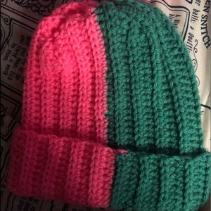 Hand crocheted teal and hot pink ribbed beanie. One size fits most.